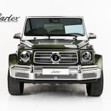 Carlex G63 Fern Vintage in smaragdgrün mit breiter Karosserie, von vorne fotografiert.