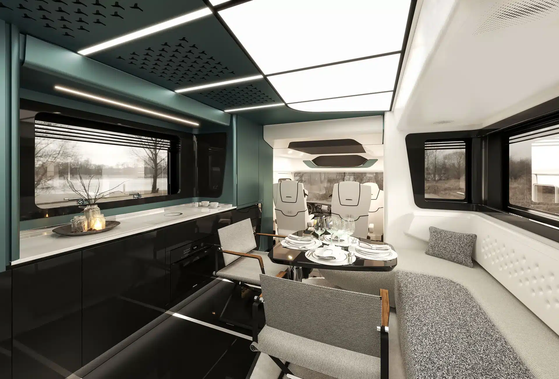 Innenaufnahme des Dembell Large Garage Reisemobils mit Essbereich, moderner Küche und Fahrerkabine