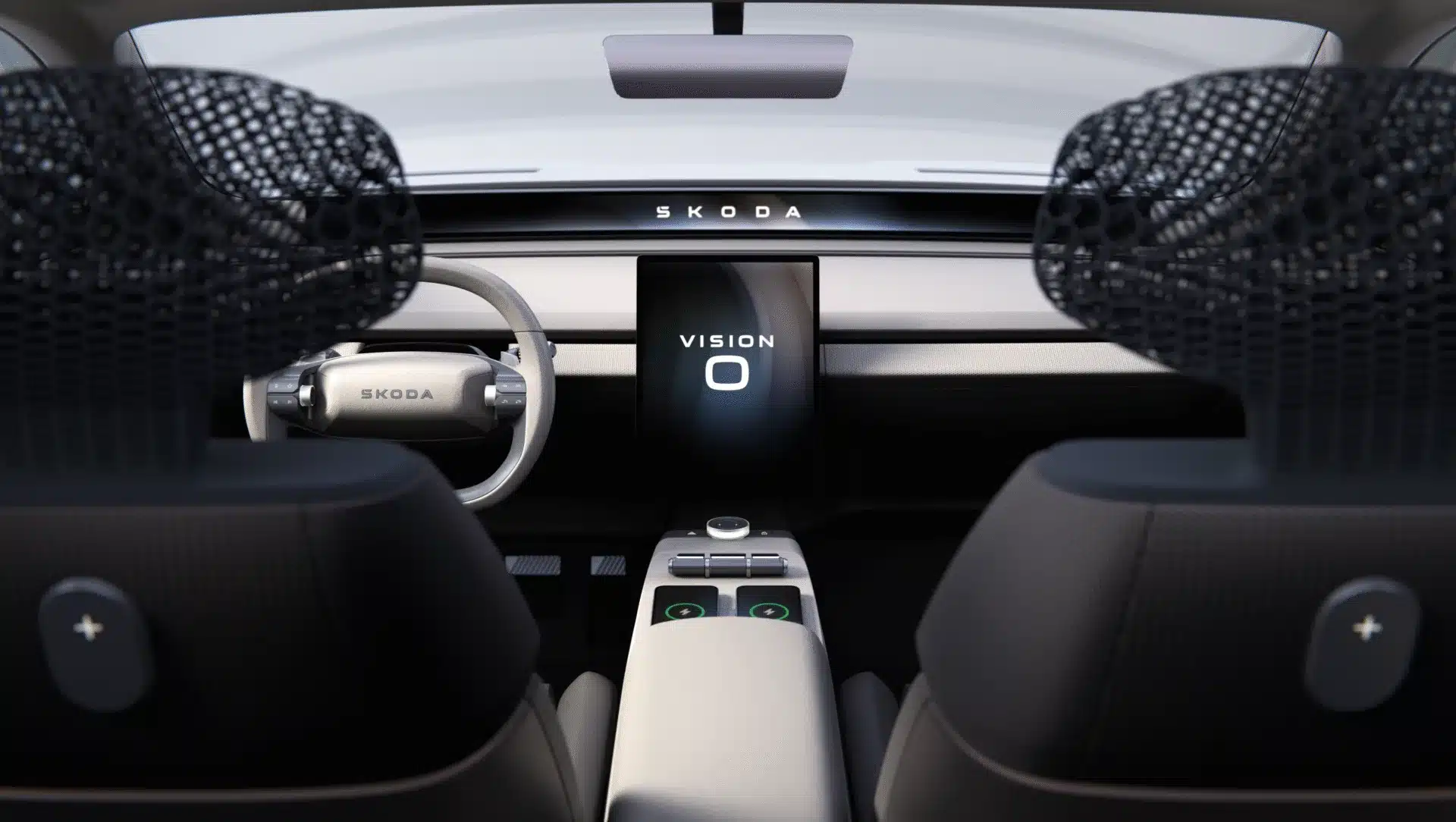 Innenansicht des Škoda Vision O mit digitalen Anzeigen, neuartigem Lenkrad und transparenten Kopfstützen