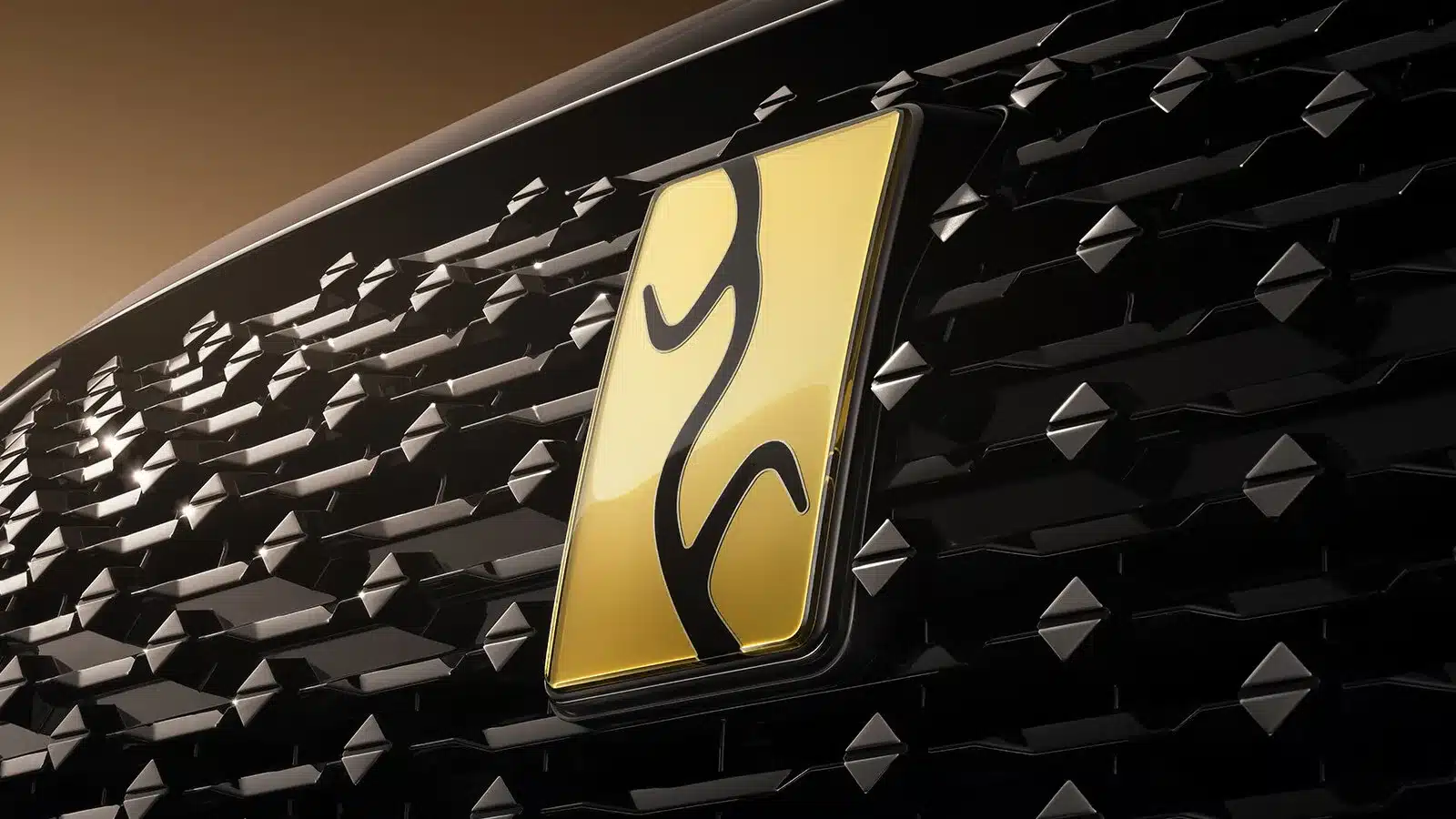 Detailaufnahme des goldfarbenen YangWang-Emblems auf dem schwarzen Kühlergrill des U8L Executive-SUV
