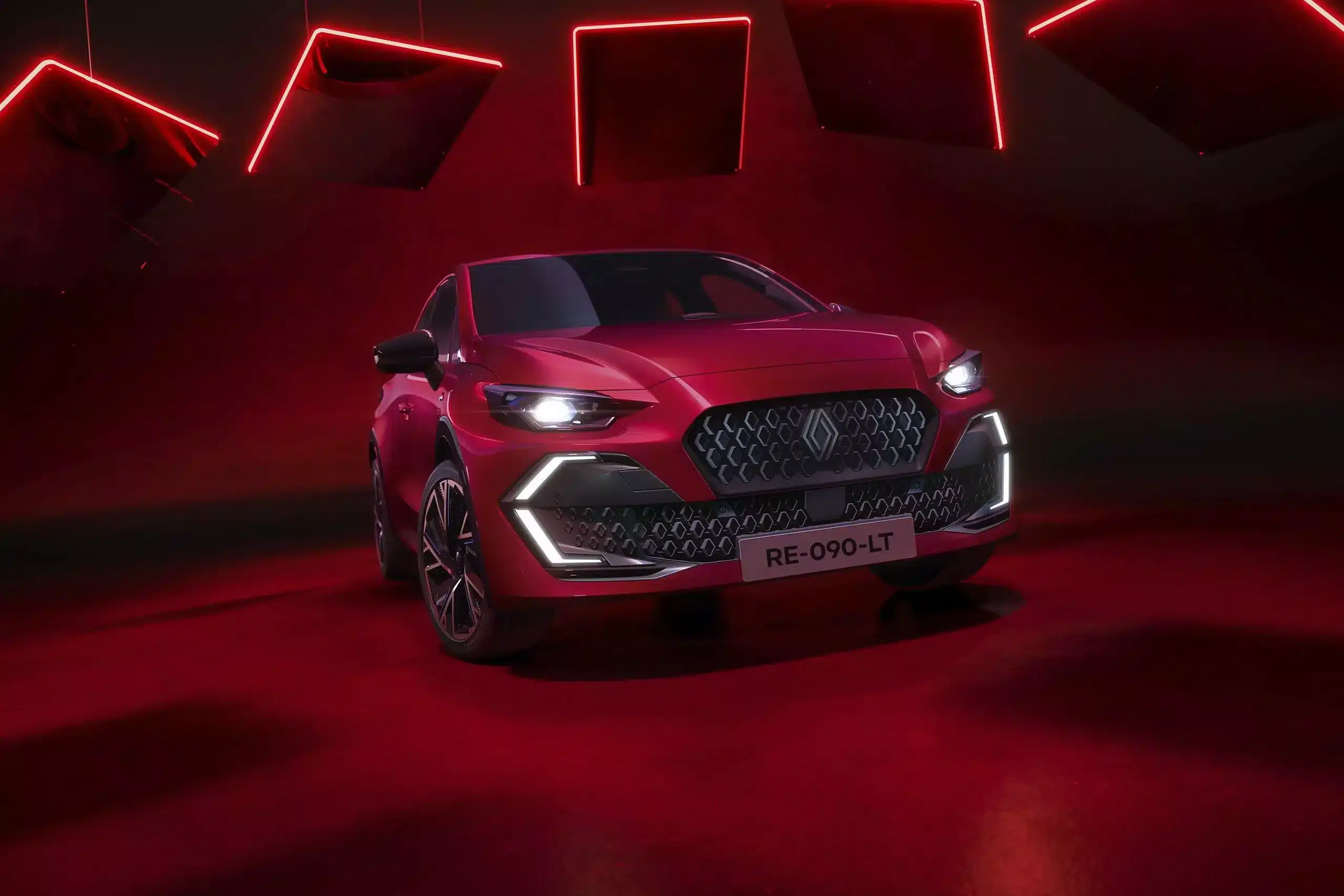 Nouvelle Renault Clio Full Hybrid E-Tech 2026 in Rot vor illuminiertem roten Hintergrund mit hervorgehobener Fahrzeugfront und modernen LED-Scheinwerfern.