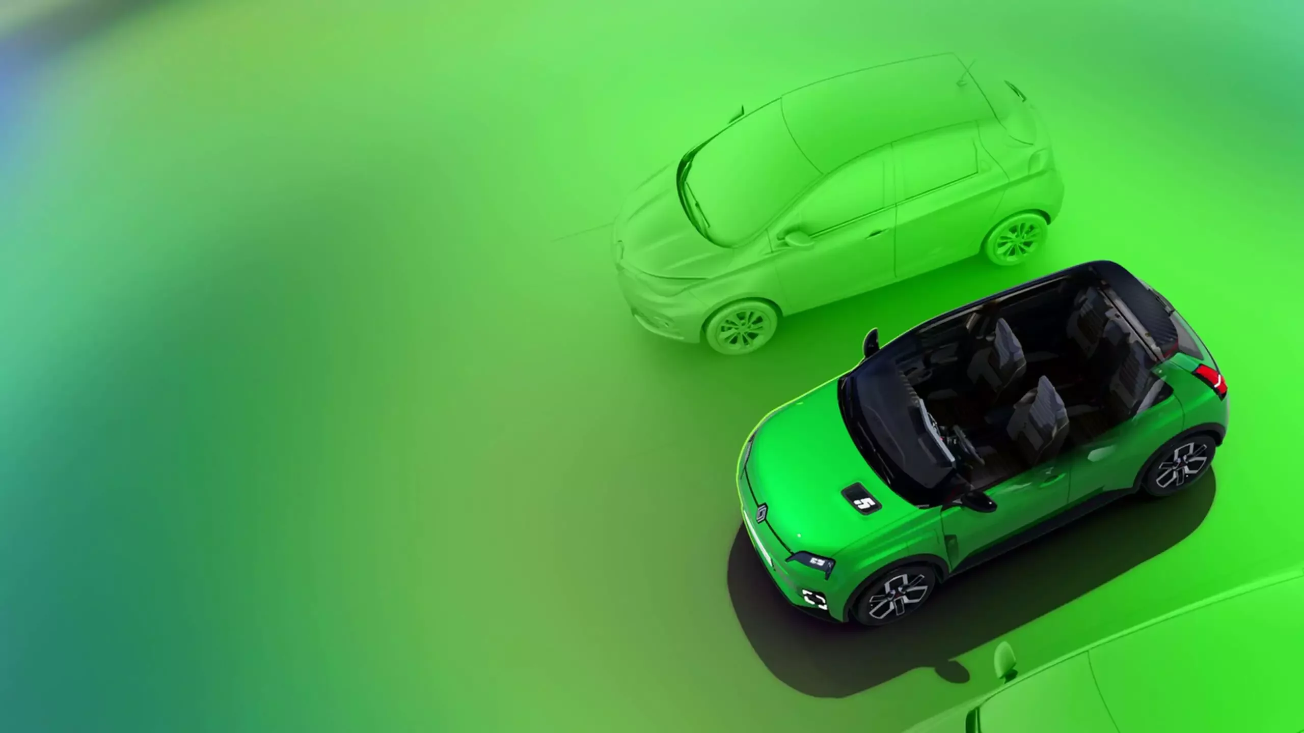 Renault 5 E-Tech Electric in grün von oben in einem Studio mit grünem Hintergrund.