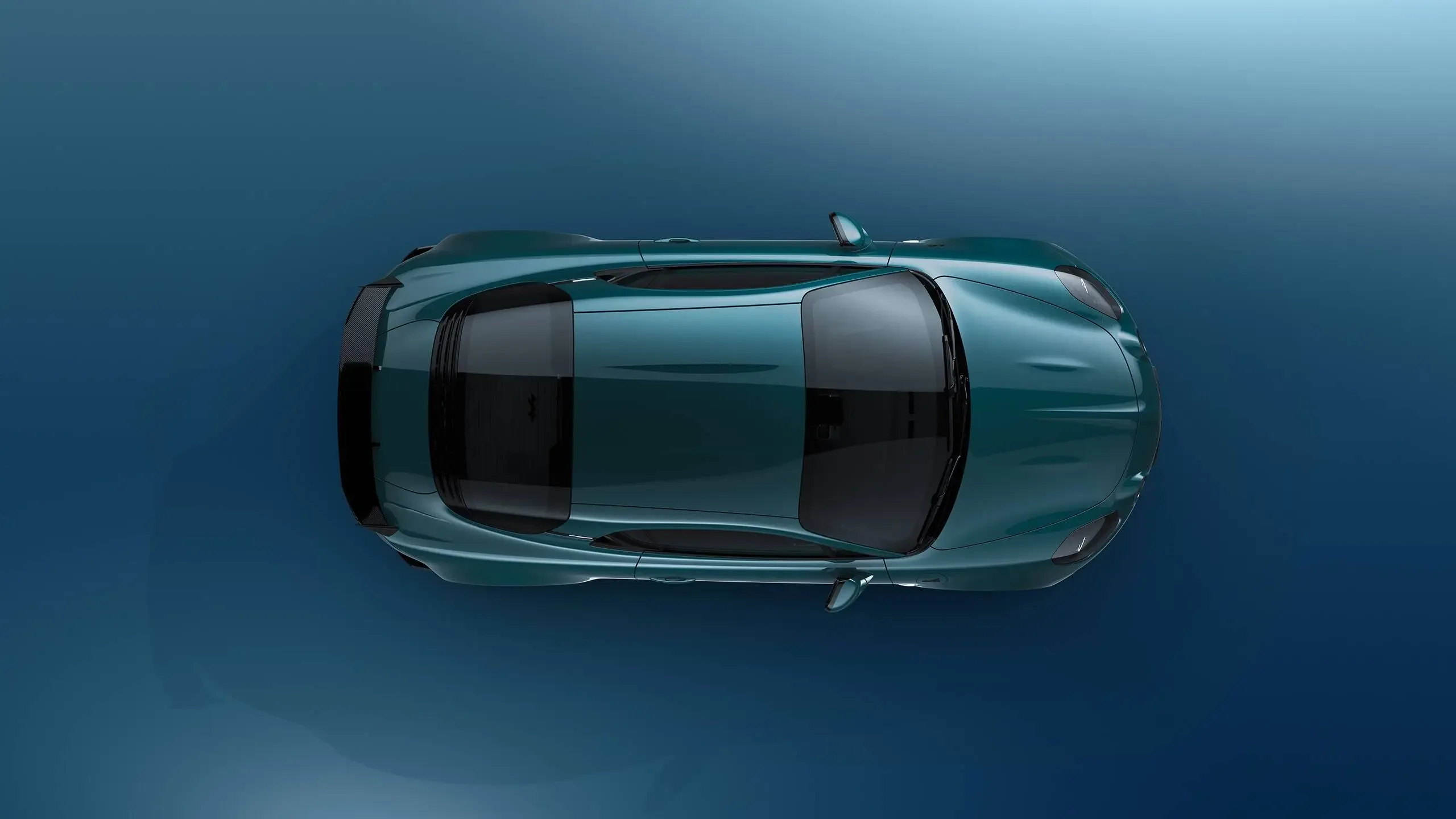 Obenansicht der Alpine A110 GTS in blauer Lackierung vor blauem Hintergrund.