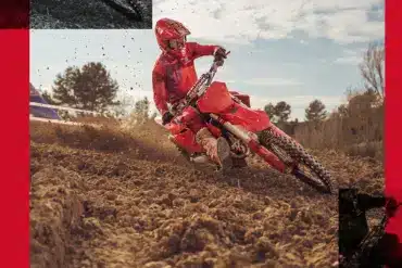 Fahrer auf einer GASGAS MC 450F 2026 Motocross-Maschine auf schlammiger Strecke.