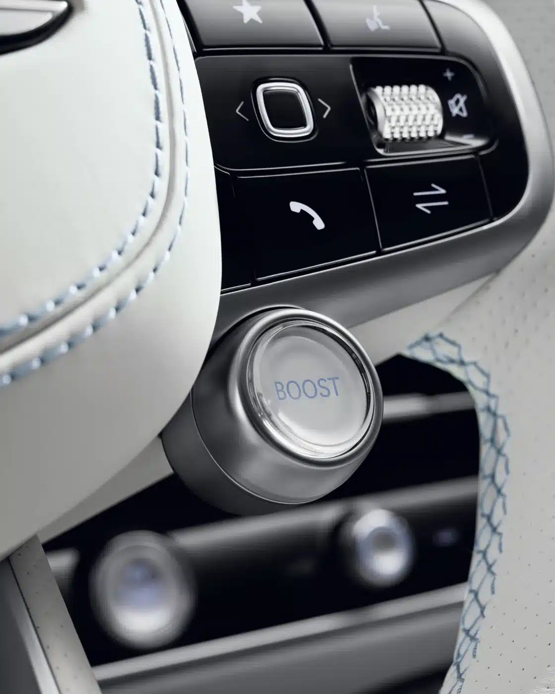 Nahaufnahme des Boost-Knopfs am Lenkrad des Genesis Electrified GV70