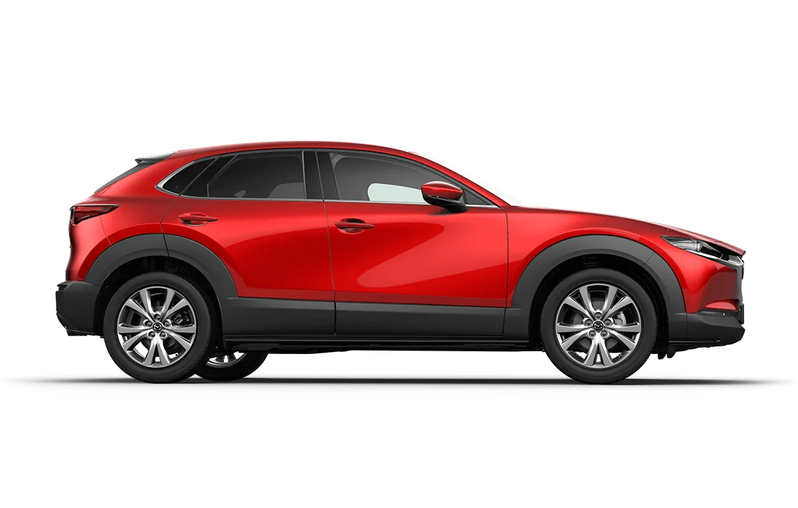 Rote Seitenansicht eines Mazda CX-30 SUV mit schwarzen Radläufen und modernen Designelementen.