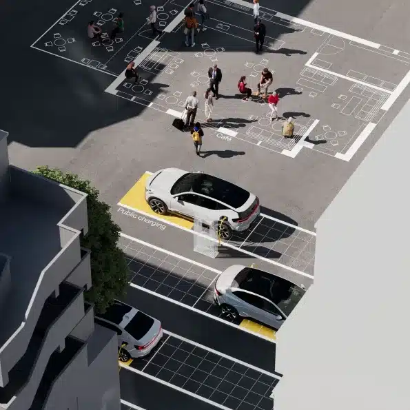 Polestar Elektroautos beim Laden an öffentlichen Ladesäulen mit Menschen in einer Stadtansicht von oben