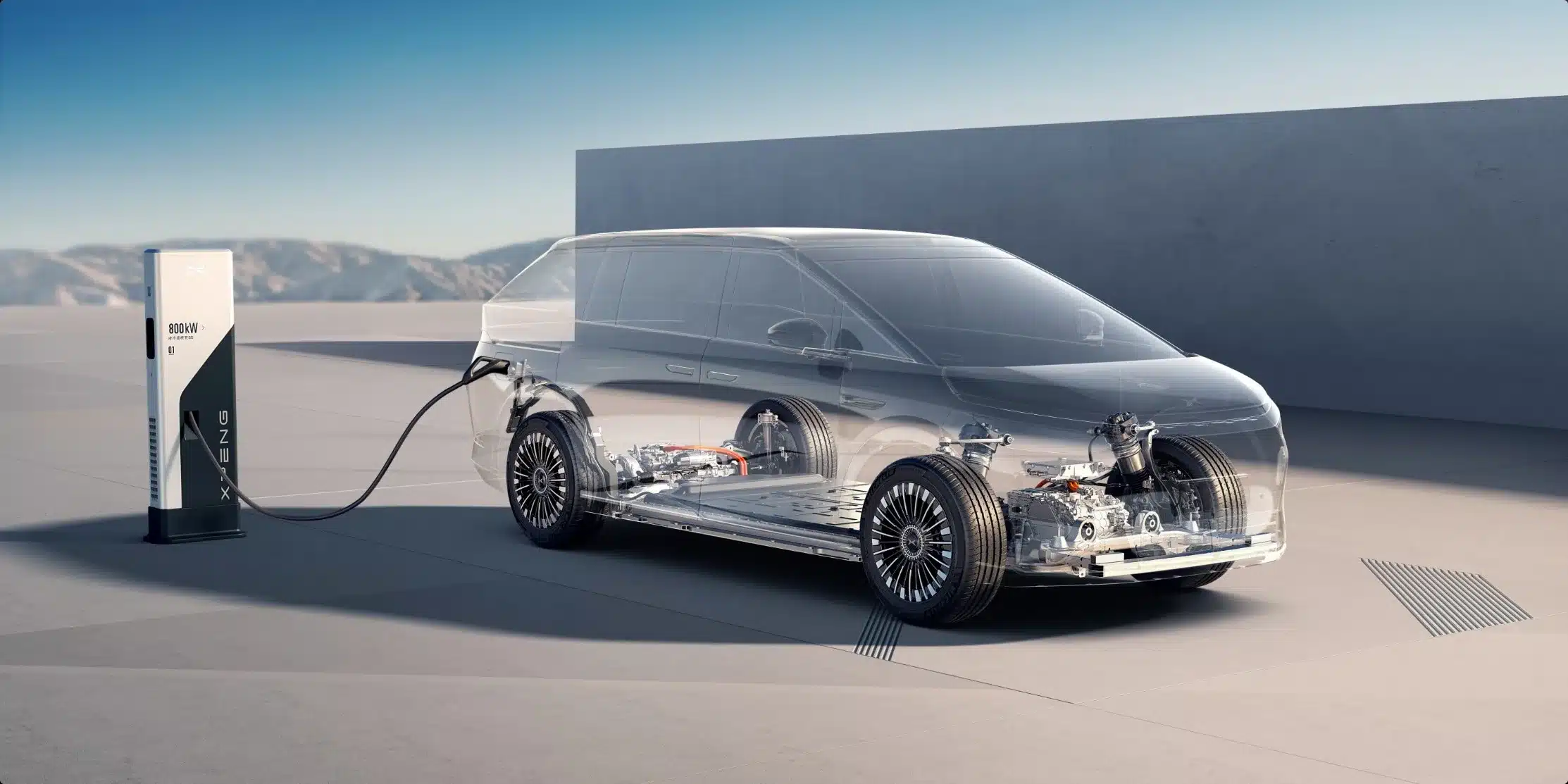 Der XPENG X9 als transparent dargestellter Van an einer XPENG-Ladestation, Fokus auf den elektrischen Antrieb und Technik.