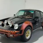 1987er Porsche 911 Carrera 3.2 G-Modell als Safari-Umbau mit Zusatzscheinwerfern, schwarzen und kupferfarbenen Karosseriedetails