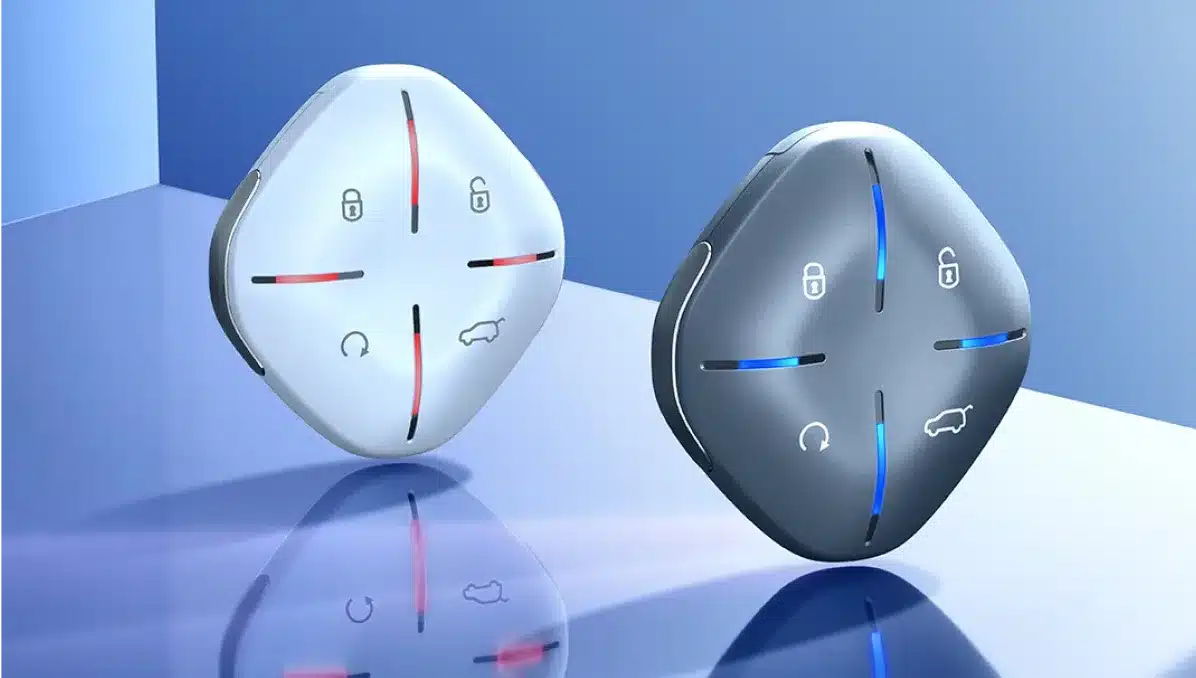 Zwei moderne Jetour Dashing Fahrzeugschlüssel mit LED-beleuchteten Symbolen auf glänzender Oberfläche.