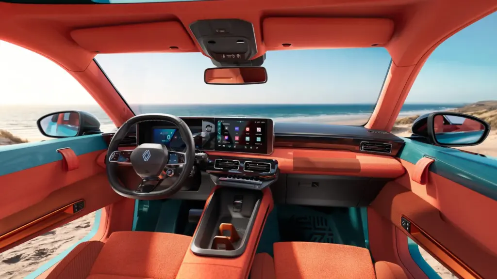 Innenraum des Renault 4 JP4x4 Concept mit orangefarbenen Sitzen und Dashboard, Blick aufs Meer, modernes Display.