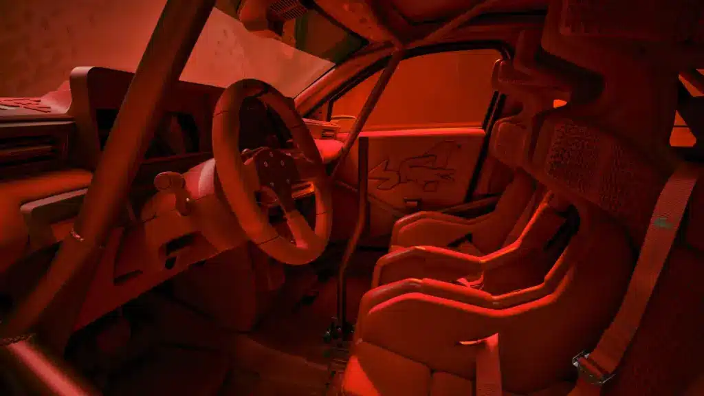Detailaufnahme des rot gestalteten Innenraums des Alpine Lacoste A290 Rallye mit Motorsportsitzen und Crocodile-Logo.