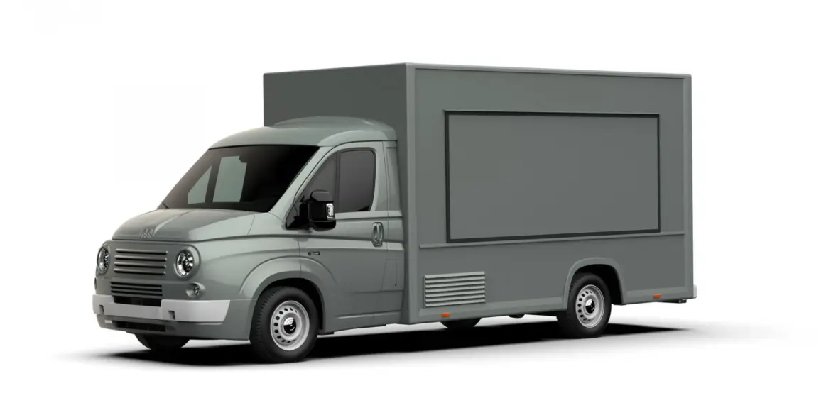 Seitenansicht eines grauen Caselani 616N Food Truck Modern Style auf Basis des Fiat Ducato im Retro-Design mit runden Scheinwerfern und klassischer Front.