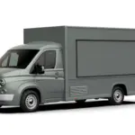 Seitenansicht eines grauen Caselani 616N Food Truck Modern Style auf Basis des Fiat Ducato im Retro-Design mit runden Scheinwerfern und klassischer Front.
