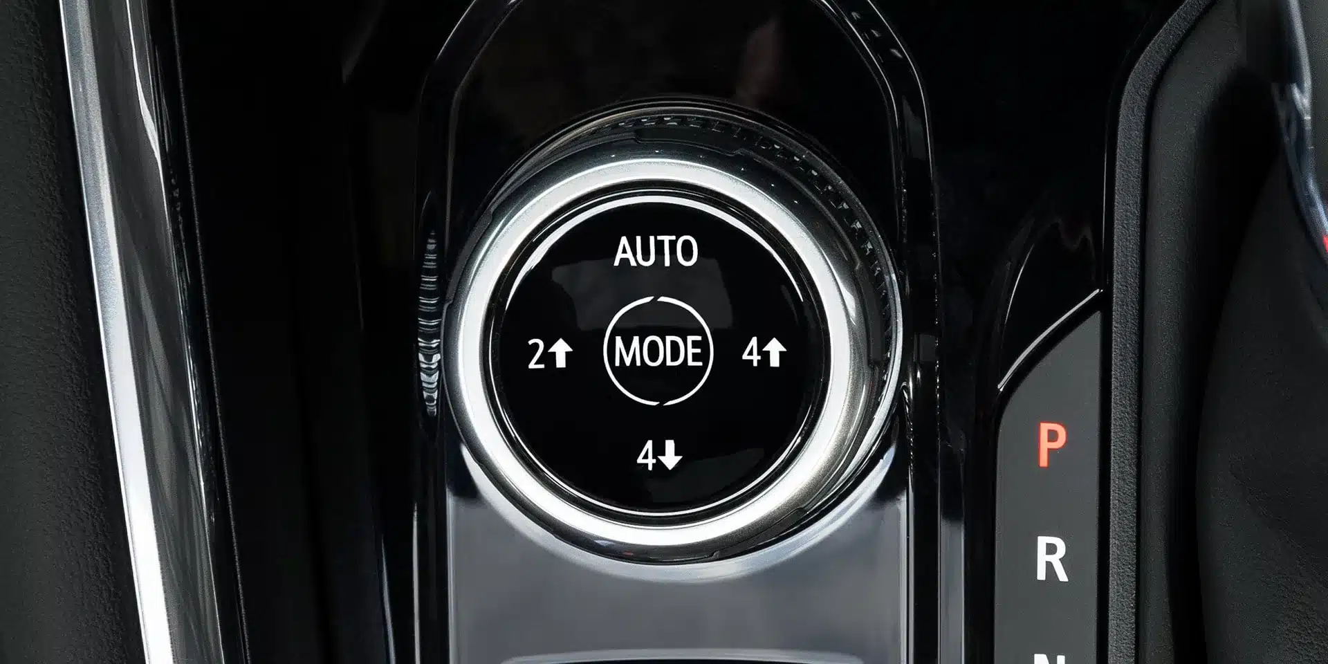 Detailaufnahme des Fahrmodusschalters im GMC Canyon 2026 mit Auto-, 2WD- und 4WD-Modi.