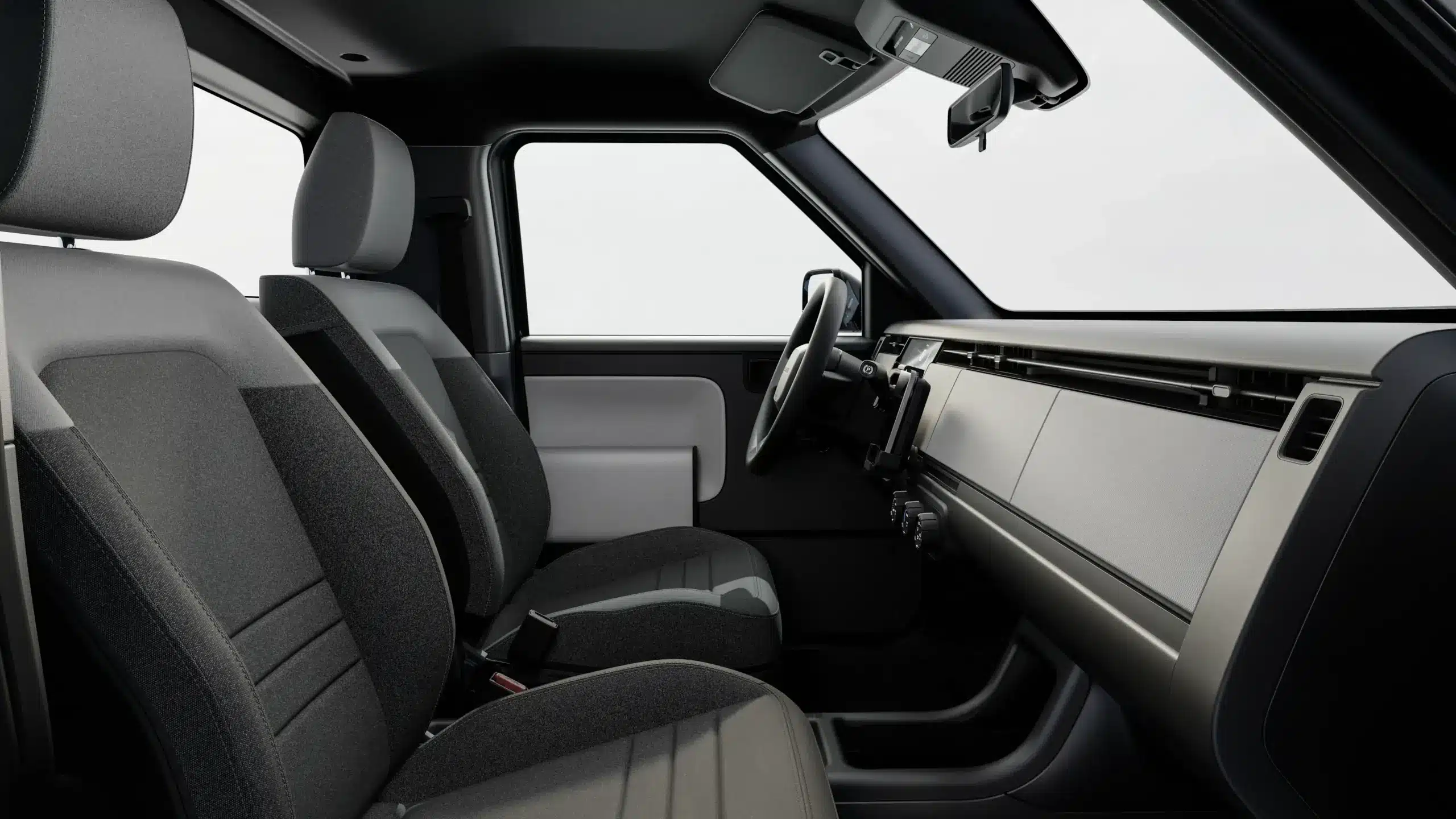 Innenraum des Blank Slate Elektroautos mit schlichtem, funktionalem Cockpit und Stoffsitze